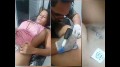 Cute chubby girl having tattoo on pussy
