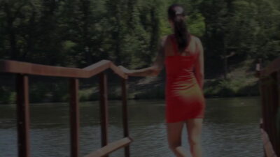 Ali Bordeaux pees outside by the riverside